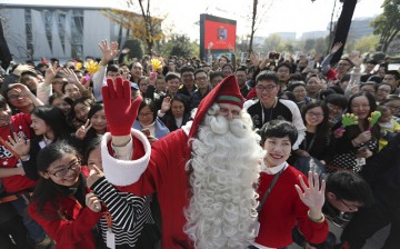 The official Santa Claus, authorized by the United Nations, appears at the campus of Chinese e-commerce powerhouse Alibaba in Hangzhou, Zhejiang Province, on Friday, Dec. 23, 2016.