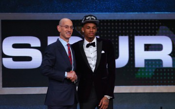 Adam Silver (L) poses for a photo with Dejounte Murray (R) after Murray was selected by the San Antonio Spurs in the first round of the 2016 NBA Draft.