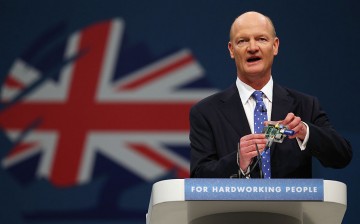 Minister of State for Universities and Science, David Willetts, holds a 'raspberry pi' computer as he delivers his speech in the main hall on the second day of the Conservative Party Conference on September 30, 2013 in Manchester, England.