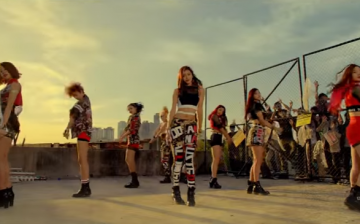 K-Pop girl group TWICE performs in the music video for their song 