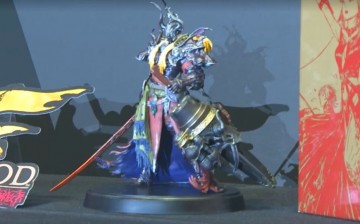 A collectible figure of Zenos yae Galvus, the main antagonist of the upcoming expansion Final Fantasy XIV: Stormblood, is displayed. 