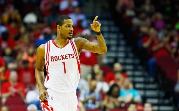 Trevor Ariza of the Houston Rockets celebrates a three-point basket against the Memphis Grizzlies during their game at the Toyota Center on March 14, 2016 in Houston, Texas.
