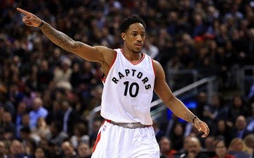 DeMar DeRozan of the Toronto Raptors signals to teammates during the first half of an NBA game against the Cleveland Cavaliers at Air Canada Centre on December 5, 2016 in Toronto, Canada. 