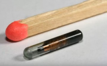 An implantable device is compared with a matchstick for the size difference.