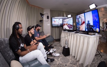 Seattle Seahawks Richard Sherman (L) challenges Hike the Gamer (R) in Call of Duty: Black Ops 3 with Typical Gamer (C) on April 30, 2016 in New York City.