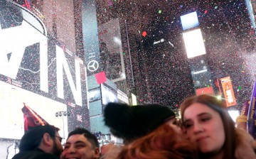 Confetti falls as people celebrate New Year's eve in Times Square in New York City just after midnight on January 01, 2017. 