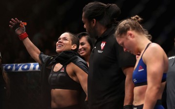 Amanda Nunes of Brazil reacts after defeating Ronda Rousey in their UFC women's bantamweight championship bout during the UFC 207 event at T-Mobile Arena on December 30, 2016 in Las Vegas, Nevada. 