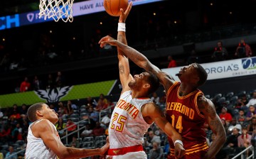 Thabo Sefolosha of the Atlanta Hawks battles for a rebound against DeAndre Liggins of the Cleveland Cavaliers at Philips Arena on October 10, 2016 in Atlanta, Georgia. 