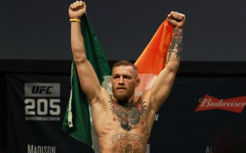 UFC Featherweight Champion Conor McGregor reacts as he walks on stage for UFC 205 Weigh-ins at Madison Square Garden on November 11, 2016 in New York City. 