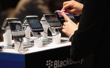 Visitors try out Blackberry smartphones at the Blackberry stand on the first day of the CeBIT 2012 technology trade fair on March 6, 2012 in Hanover, Germany. 