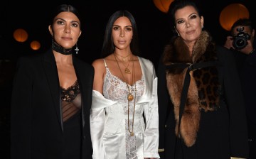 Kim Kardashian (C) with her mom Kris Jenner (R) and her sister Courtney Kardashian (L) at Paris Fashion Week last Oct. 2, 2016.