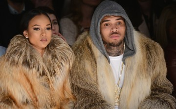 Karrueche Tran (L) and Chris Brown attends the Michael Costello fashion show during Mercedes-Benz Fashion Week Fall 2015 at The Salon at Lincoln Center on February 17, 2015 in New York City. 