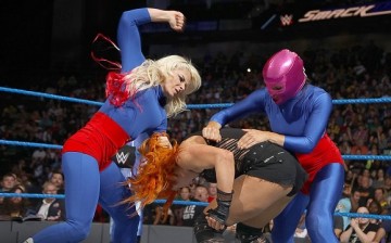 Alexa Bliss and La Luchadora attacks Becky Lynch. 