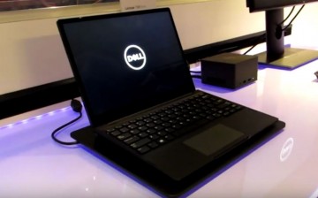 The Dell Latitude 7285 is put on display while showcasing most of its features. 
