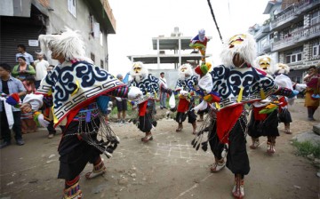 Performers dancing the Tashi Sholpa, a Tibetan opera dance for good luck.