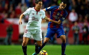 Samir Nasri (L) battles for the ball against Sergio Busquets (R) in the game between Sevilla and Barcelona in the Liga Santander last Nov. 6, 2016.