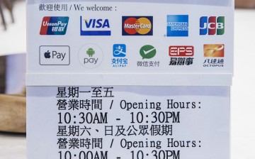 Wireless payment methods in accepted at a Hong Kong shop.