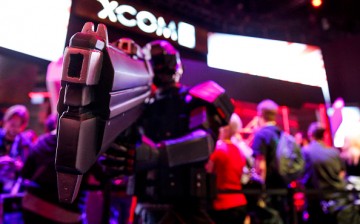 A person dressed as a solider from the X-COM 2 video game poses for a picture during the E3 Electronic Entertainment Expo in Los Angeles, California, U.S., on Tuesday, June 16, 2015.