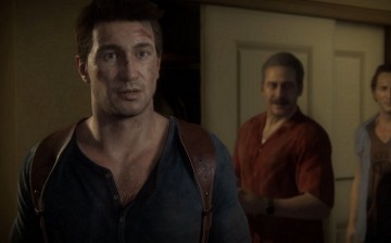 Lead protagonist Nathan Drake being led into a room by his abductors in 'Uncharted 4: A Thief's End.'
