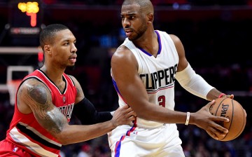 Damian Lillard of the Portland Trail Blazers guards Chris Paul of the LA Clippers during a 121-120 Clipper win at Staples Center on Dec. 12, 2016 in Los Angeles, California.