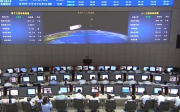 A glimpse of the Jiuquan Satellite Launch Center's control room during a rocket launch.