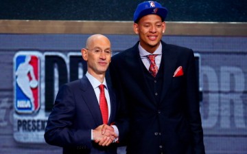  Isaiah Austin of Baylor (R) shakes hands with NBA Commissioner Adam Silver as he is honored on stage during the 2014 NBA Draft at Barclays Center on June 26, 2014 in the Brooklyn borough of New York City. 