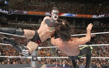 Finn Balor lands a heavy strike against Seth Rollins during their SummerSlam matchup for the inaugural WWE Universal Championship title.