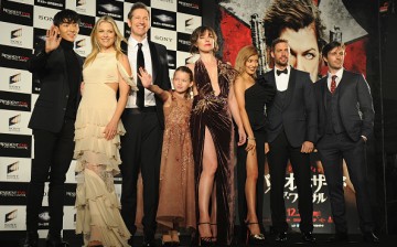 Milla Jovovich speaks on poses on stage with cast at the world premiere of 'Resident Evil: The Final Chapter' at the Roppongi Hills on December 13, 2016 in Tokyo, Japan.   