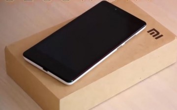 Xiaomi smartphone is placed on top a Mi box for display.