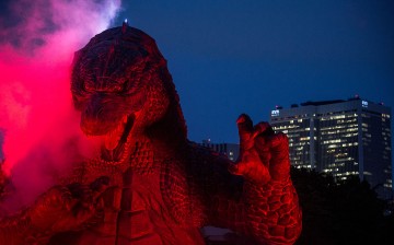 A 6.6 meter replica Godzilla is lit up during a press preview at Tokyo Midtown on July 17, 2014 in Tokyo, Japan.