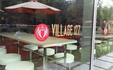 The facade of Village 127 French Bakery and Cafe 