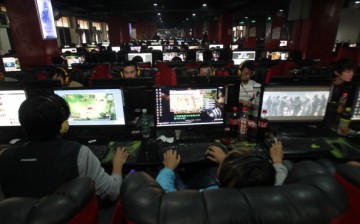 People use computers at an Internet cafe in Zhengzhou, China.