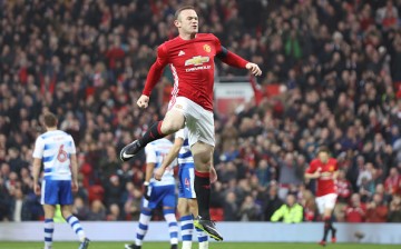 Even with a chance to earn an absurd amount of money in China, Wayne Rooney insists he is happy with Manchester United.