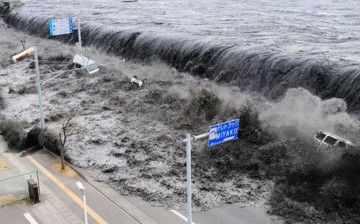 A tsunami generated by the 2011 Tōhoku earthquake and tsunami strikes Japan.           
