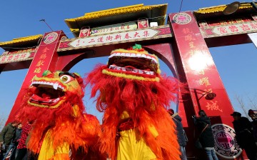  Local artists perform lion dance during a Spring Festival market on January 22, 2017 in Lianyungang, Jiangsu Province of China.