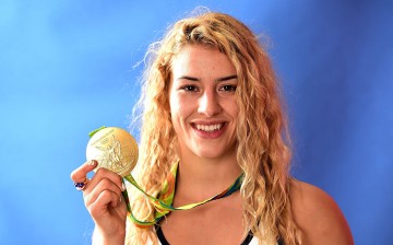 Helen Maroulis of the United States poses for a photo with her gold medal on the Today show set on Copacabana Beach on August 19, 2016 in Rio de Janeiro, Brazil.