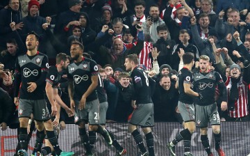 Players of Southampton FC celebrate after a goal.