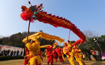 People celebrate the Lunar New Year with a dragon dance in Nantong, Jiangsu Province.