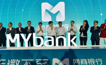 Jack Ma (6th, left), chairman of Alibaba Group Holding Ltd., attends the opening ceremony of Alibaba-backed Internet bank MYbank in Hangzhou, China.