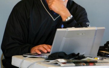 Computer programmer doing a run test on a system he developed.