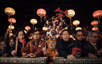 People make incense offerings and pray at Wong Tai Sin Temple on the first day of Lunar New Year holiday on Feb. 8, 2016 in Hong Kong.