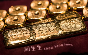 Gold bars of five taels and one tael are arranged for a photograph inside a Chow Sang Sang Holdings International Ltd. jewelry store in Hong Kong.