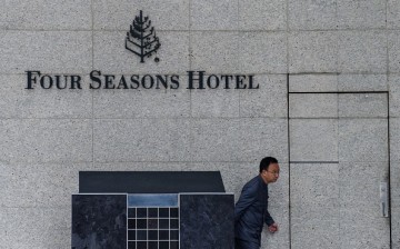 A man walks past the hotel where Chinese billionaire Xiao Jianhua was reportedly abducted by mainland security agents last month. 