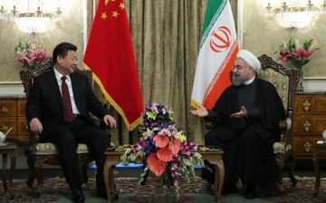 Chinese President Xi Jinping and Iranian President Hassan Rouhani pose during a meeting at Saadabad Palace in Tehran, Iran, on Jan. 23, 2016.