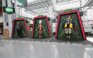Fans pose for photos in the 'Rick and Morty' Galactic Federation Prison at at New York Comic Con on October 8, 2016 in New York City.