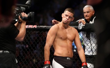 Nate Diaz eyes Conor McGregor from across the Octagon before their welterweight rematch at the UFC 202 event at T-Mobile Arena on August 20, 2016 in Las Vegas, Nevada. 