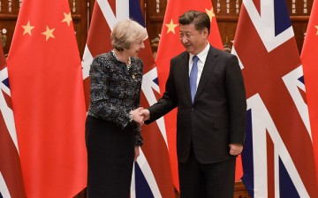 Chinese President Xi Jinping shakes hand with British Prime Minister Theresa May before their meeting at the West Lake State House on Sept. 5, 2016, in Hangzhou, China.