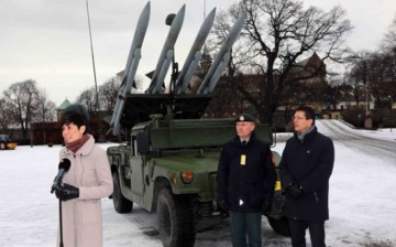 Noregian defense minister Ine Eriksen Søreide with the Norwegian Army's new Kongsberg air defense missile battery.               