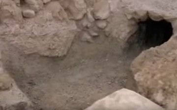  A small entrance of the cave is showcased, where Dead Sea Scroll were first discovered. 