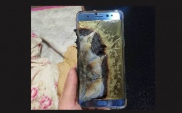 A Note 7 is held by hand to show the aftermath of the smartphone explosion. 